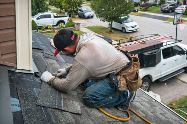 Professional Roof Replacement technician working in Dysart, PA